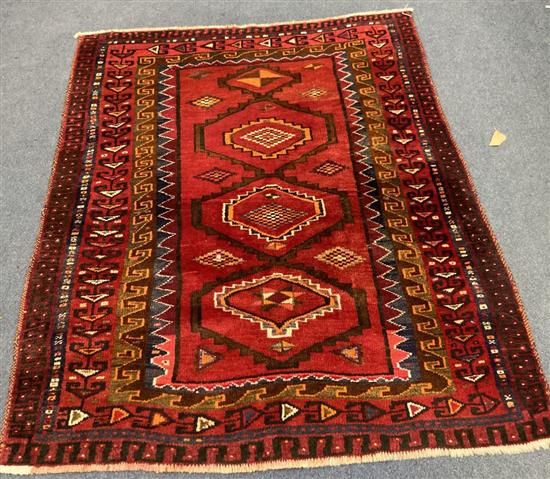 A Caucasian style red ground rug, 204 x 160cm